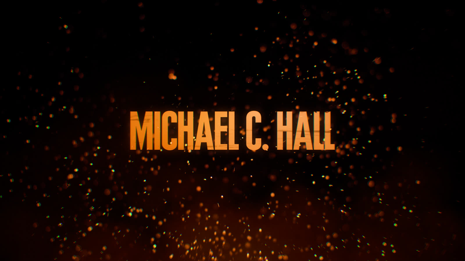 A cast credit set in rising embers